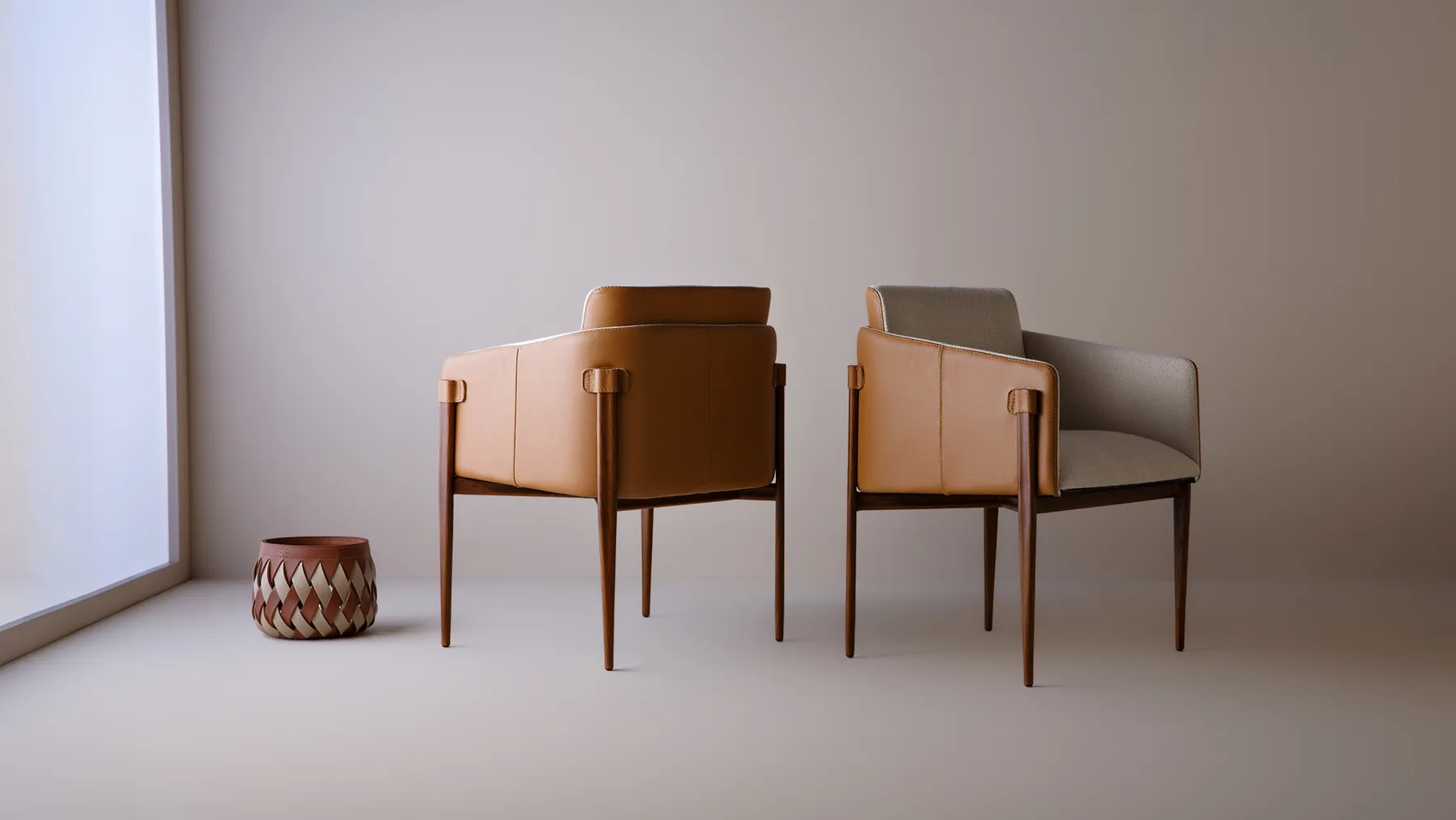 Two Smoky armchairs in leather
