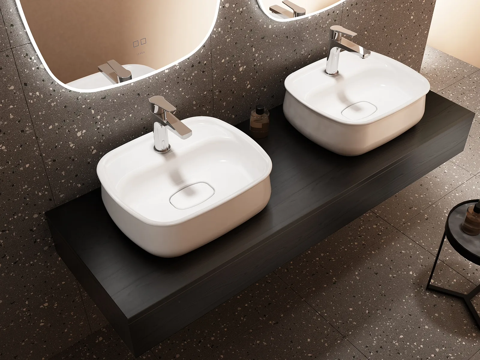 Two Fluido basins on a dark vanity top