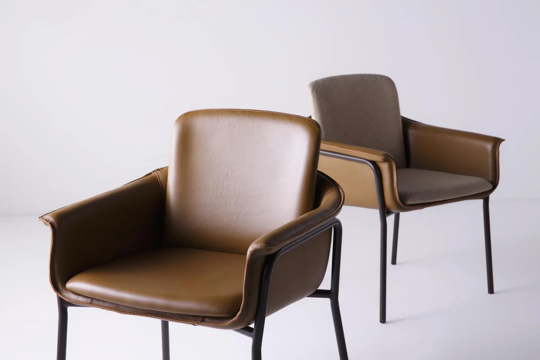 Two OMG chairs in leather