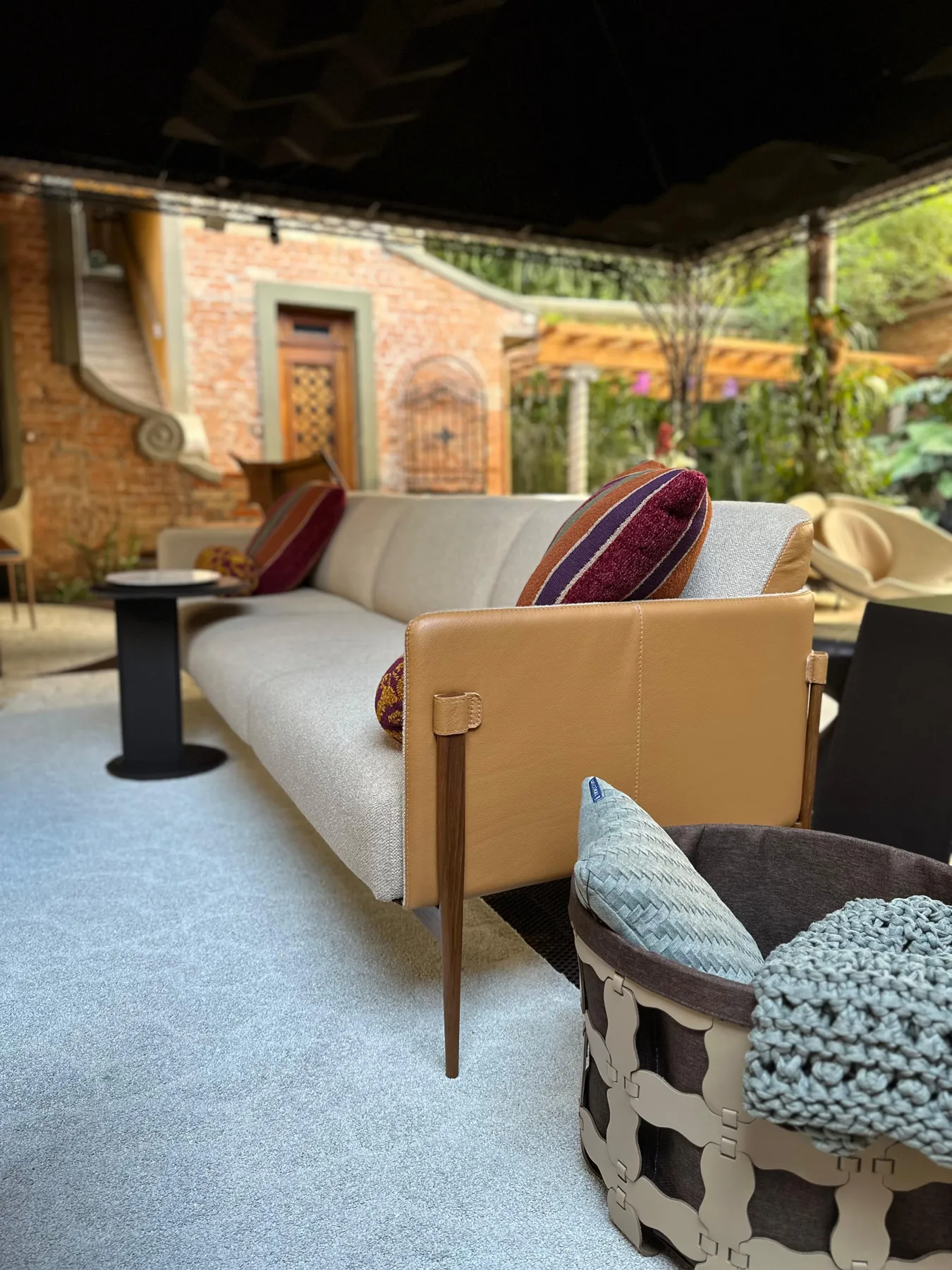 Smoky sofa, side view with the leather arm