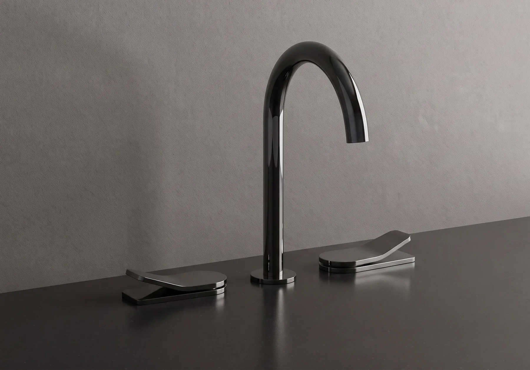 Ylon three hole basin mixer with blade levers on a dark stone top